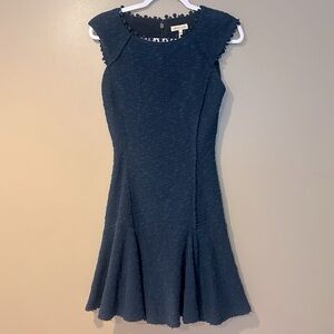 sleeveless textured fit and flare dress subtle business casual office attire